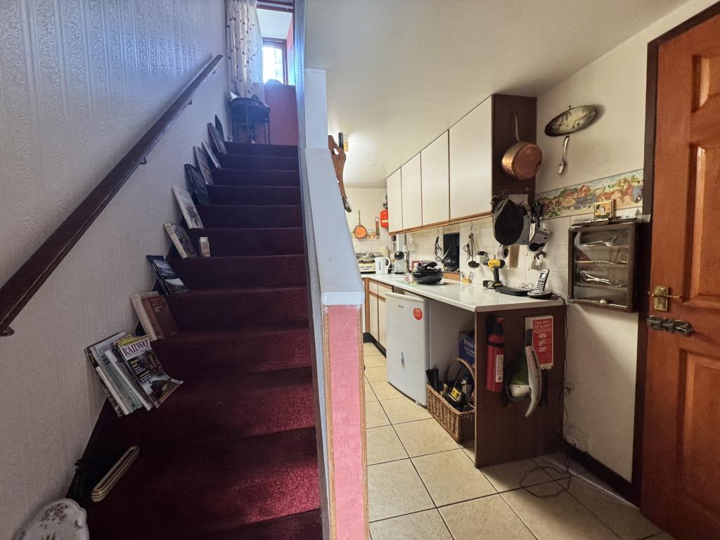 Lot: 101 - TWO-BEDROOM HOUSE FOR IMPROVEMENT IN VILLAGE LOCATION - Entrance hall to the property